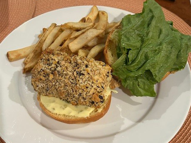 bread, lettuce and fries on a plate