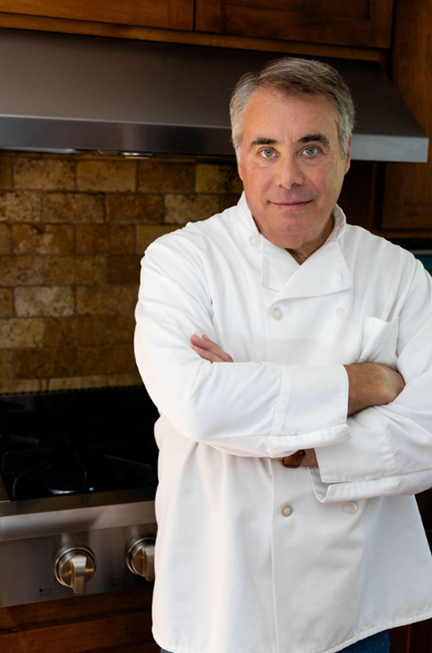 man standing wearing a chef's uniform