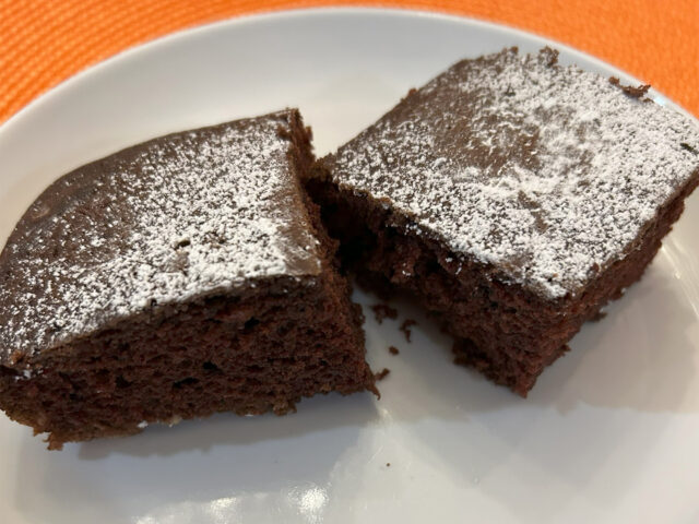 2 pieces of chocolate cake on a plate