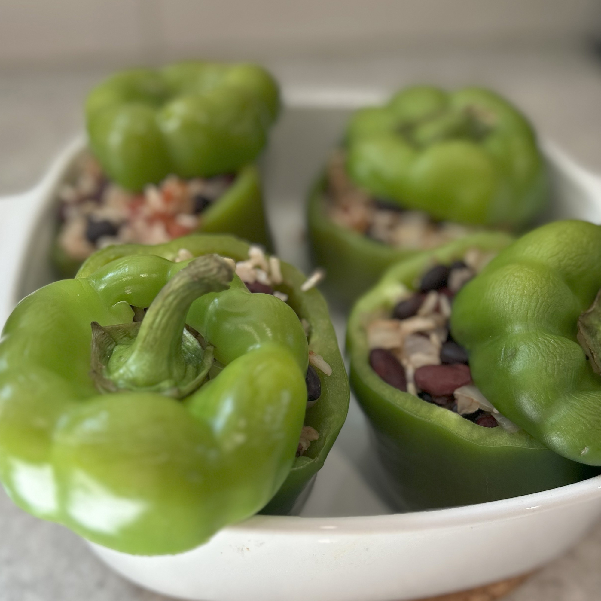 green bell peppers stuffed with black beans